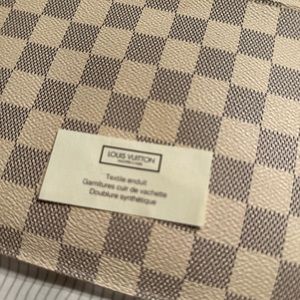 Authentic Louis Vuitton wristlet excellent condition has original interior tag